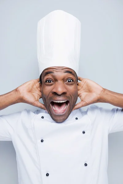 Excited young African chef