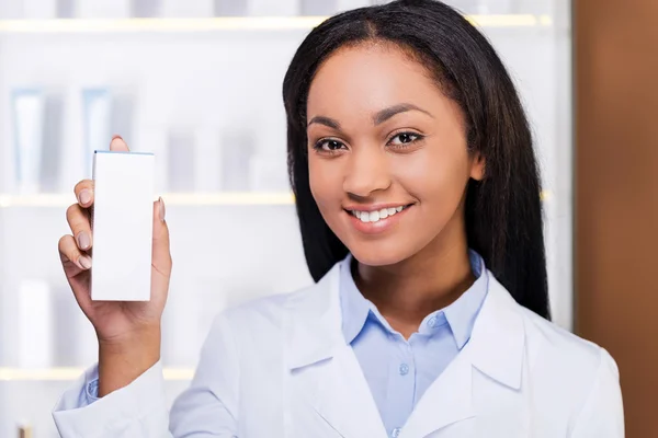 Woman holding container with medicine