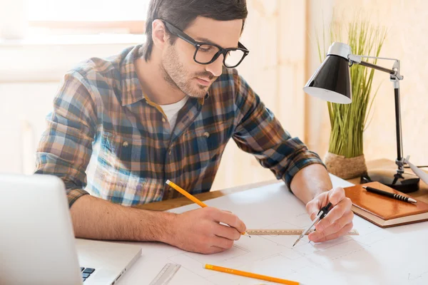 Man drawing at working place