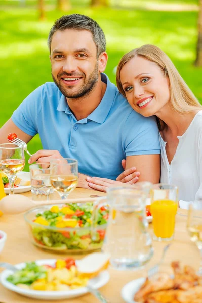 Young loving couple enjoying meal