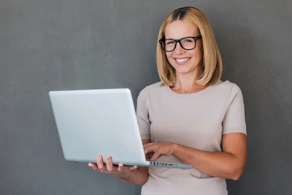 Woman holding laptop