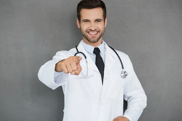 Handsome doctor in white uniform