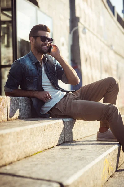 Happy  man talking on the mobile phone