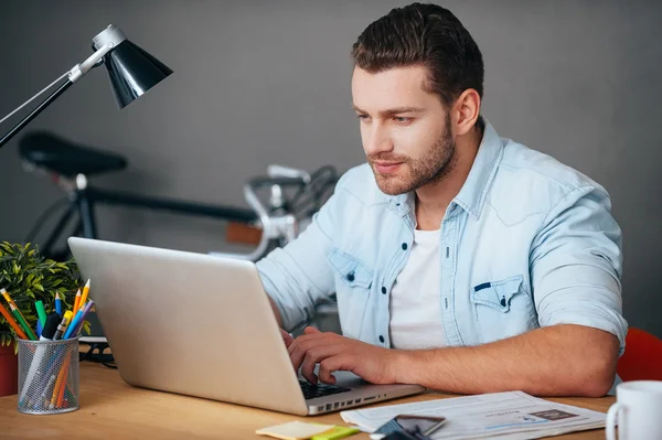 Man working on laptop  in office