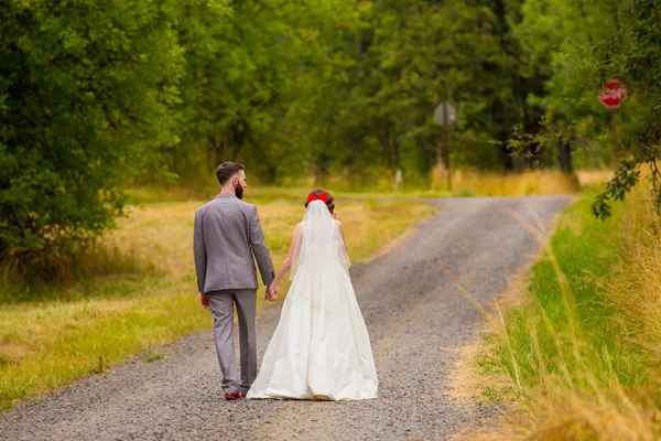 Bride and Groom on Gravel Road