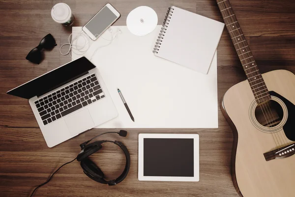 Office desk background acoustic guitar and headphones recording