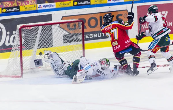 Lulea, Sweden - March 18, 2015. Per Ledin (97 Lulea Hockey) scores! Swedish Hockey League-game, between Lulea Hockey and Frolunda Indians.