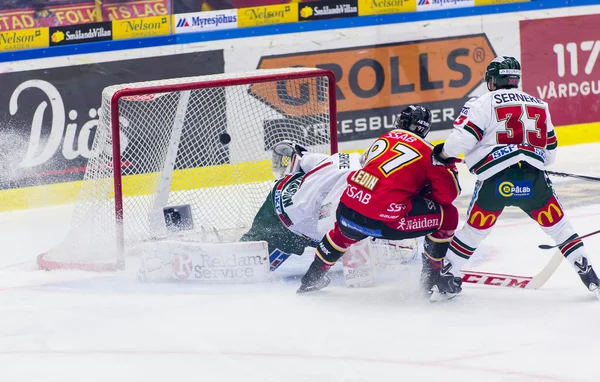 Lulea, Sweden - March 18, 2015. Per Ledin (97 Lulea Hockey) scores! Swedish Hockey League-game, between Lulea Hockey and Frolunda Indians.