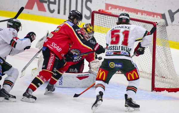 Lulea, Sweden - March 18, 2015. Joel Lassinantti (34 Lulea Hockey) catches the puck during the Swedish Hockey League-game, between Lulea Hockey and Frolunda Indians.