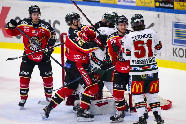 Lulea, Sweden - March 18, 2015. Kristian Nakyva  (51 Lulea Hockey) fighting with Joel Lundqvist (20 Frolunda Indians) during the Swedish Hockey League-game, between Lulea Hockey and Frolunda Indians.