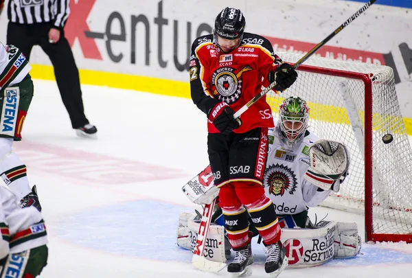 Lulea, Sweden - March 18, 2015. Lars Johansson  (1 Frolunda Indians) can\'t see the puck. Swedish Hockey League-game, between Lulea Hockey and Frolunda Indians.