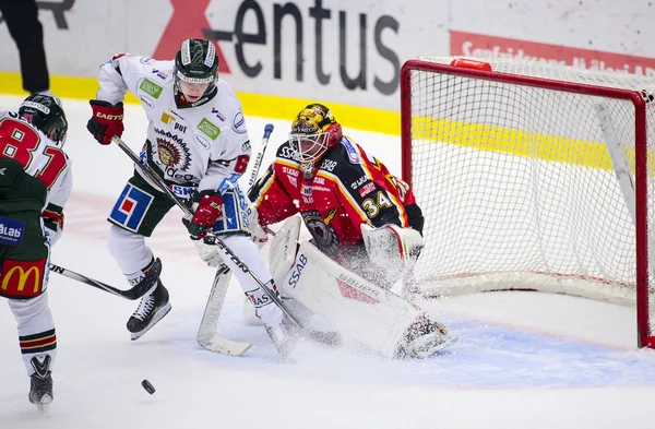 Lulea, Sweden - March 18, 2015. Joel Lassinantti (34 Lulea Hockey) is having a tough time in the net. Swedish Hockey League-game, between Lulea Hockey and Frolunda Indians.