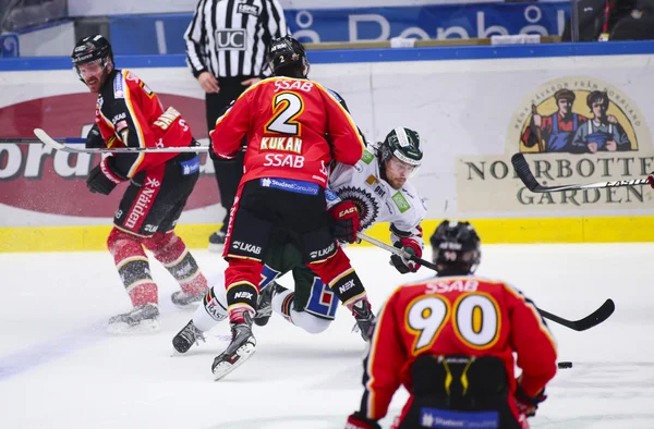 Lulea, Sweden - March 18, 2015. Dean Kukan (2 Lulea Hockey) tackles an opponent. Swedish Hockey League-game, between Lulea Hockey and Frolunda Indians.