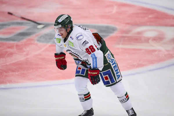 Lulea, Sweden - March 18, 2015. Andreas Johnson  (88 Frolunda Indians) hurt his knee after a tackle. Swedish Hockey League-game between Lulea Hockey and Frolunda Indians.