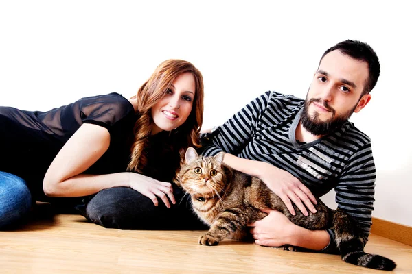 Young happy couple with her cat, pets.  Lifestyle