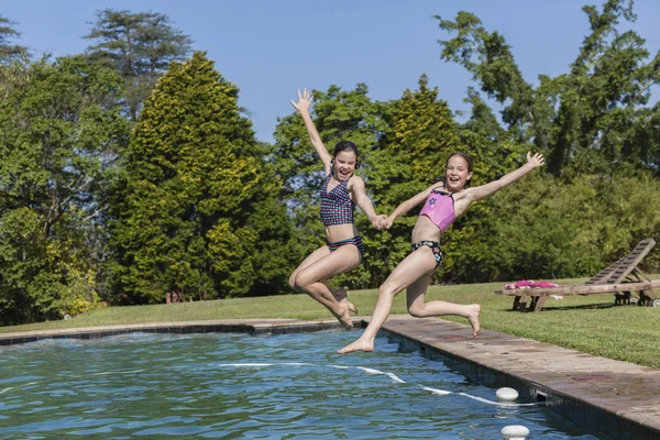 Girls Jumping Pool Fun