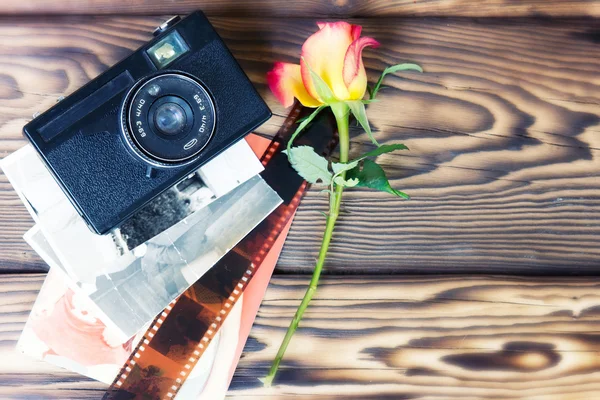 Retro vintage photo camera pictures on wooden background.