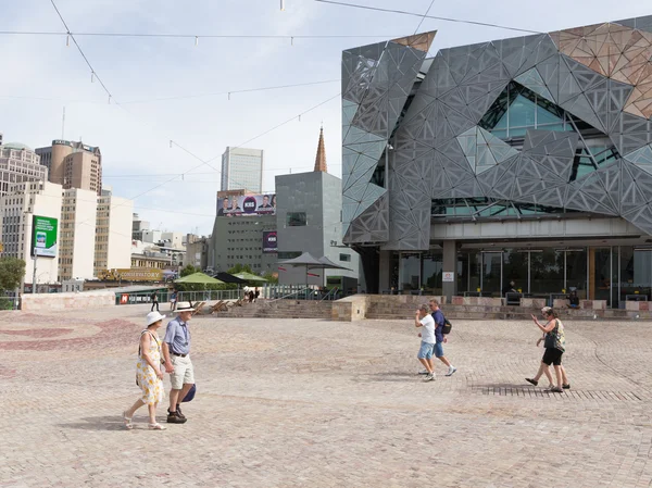 People walk at Federation Square, Melbourne