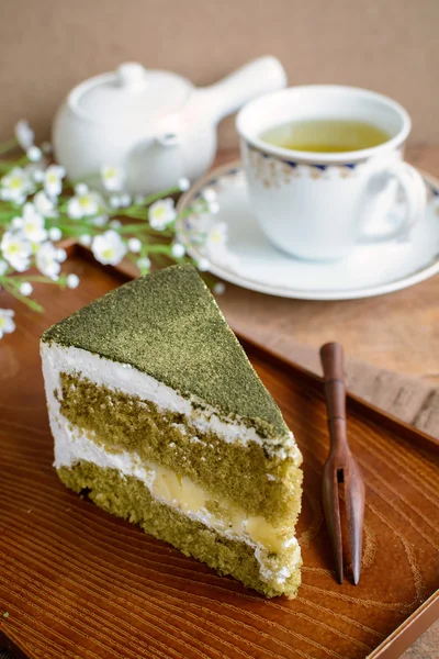 Japanese Matcha Green tea cake with cup of tea