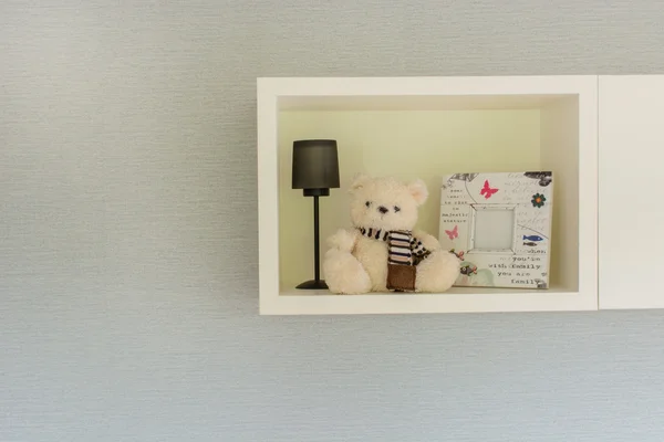 Teddy bear on shelf