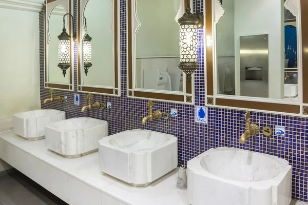Handbasin and mirror in toilet