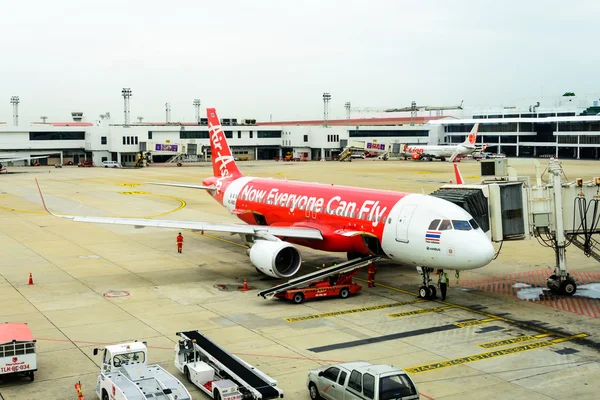 Airliner Air-Asia maintenance  checking during refueling and loading baggage