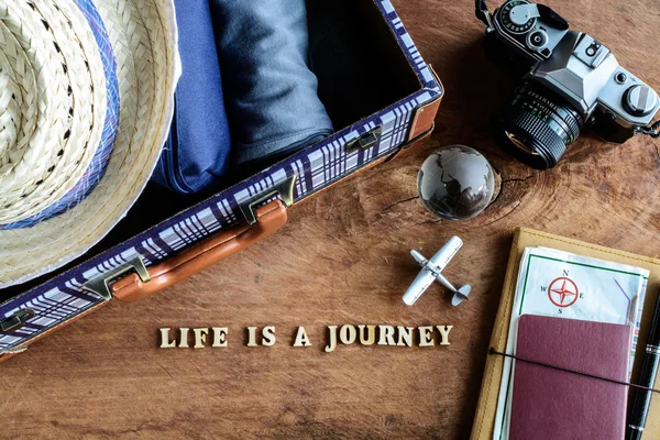 Outfit of traveler on wooden background