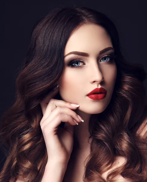 Gorgeous sexy woman with dark hair and bright makeup