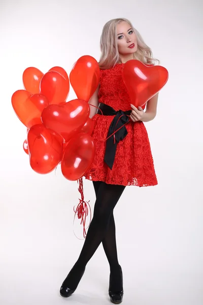 Valentine\'s day. Beautiful woman with red air balloons