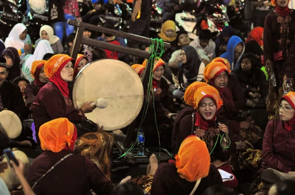 Women making music with drums, Yogyakarta city festival parade