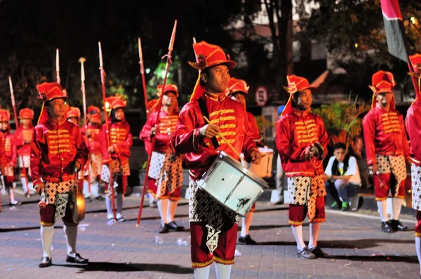 Men making music with drums, Yogyakarta city festival parade