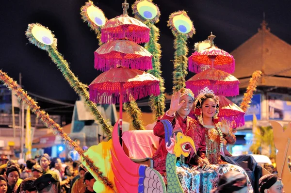Women and men dressed as royalty, Yogyakarta city festival parade
