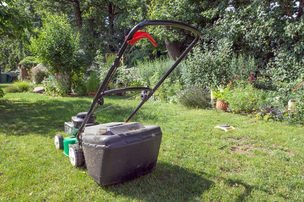 Lawn mower in the garden