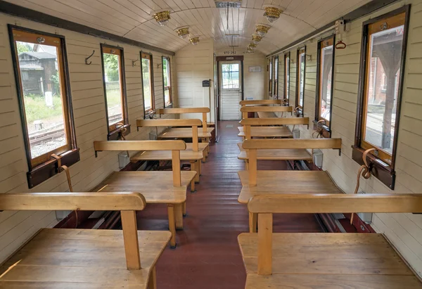 Empty wooden seats in old train