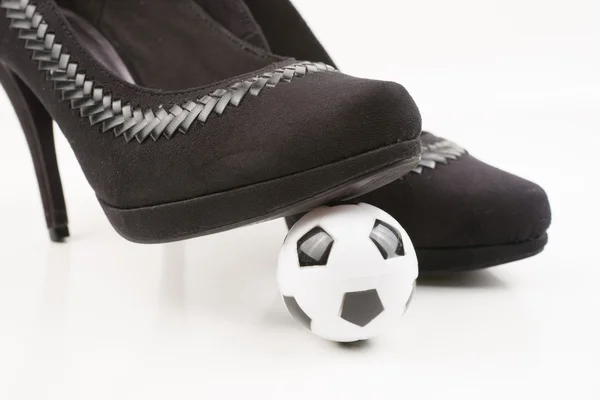 Soccer ball and high heels