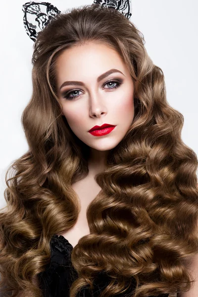 Make up. Glamour portrait of beautiful woman model with fresh makeup and romantic wavy hairstyle.