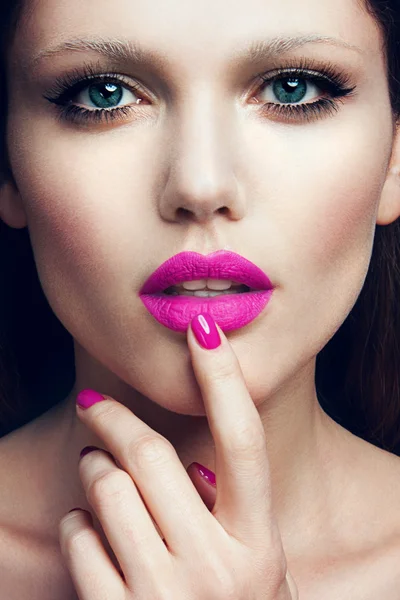 Portrait of beautiful girl with pink lips.