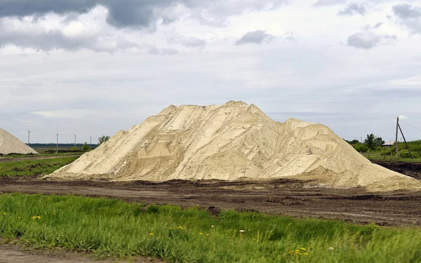 Hill of the mined sand, piled in a sand quarry