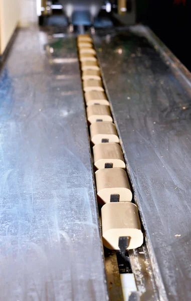 Pieces of soap on a conveyor belt