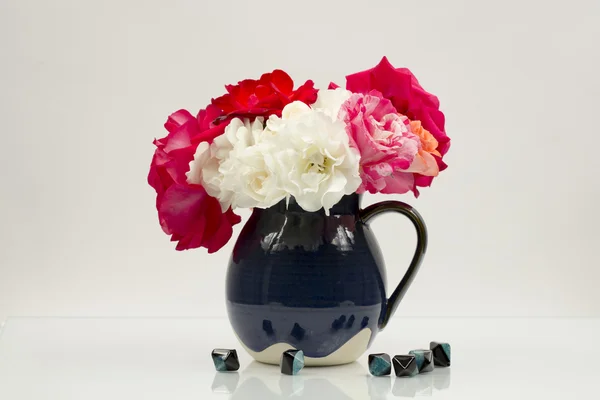 Colorful, beautiful, delicate roses in a ceramic vase