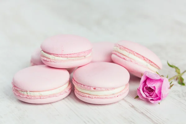 Pastel pink macaroons with rose, pastel colored, selective focus