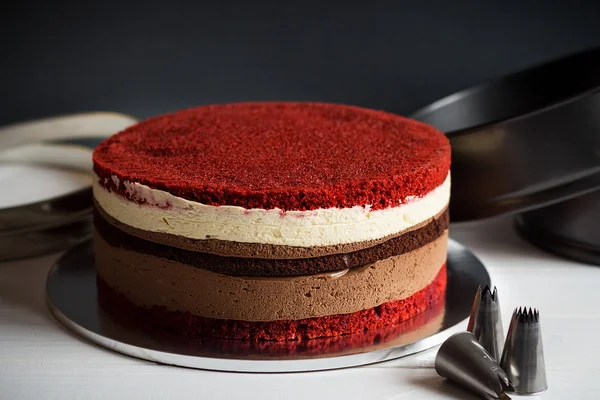 Naked layer cake with red velvet and chocolate biscuit and cream