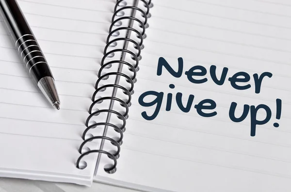 Never give up word on notebook