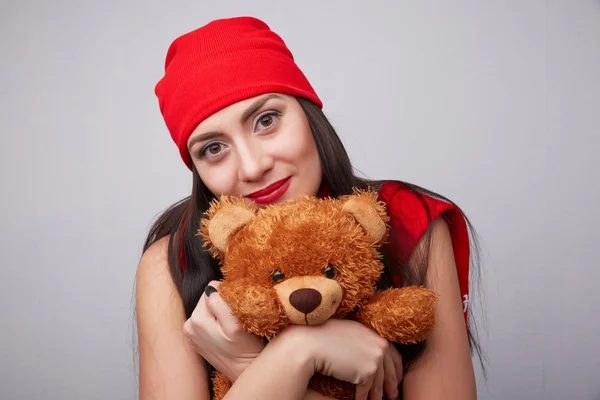 Brunette woman with teddy bear