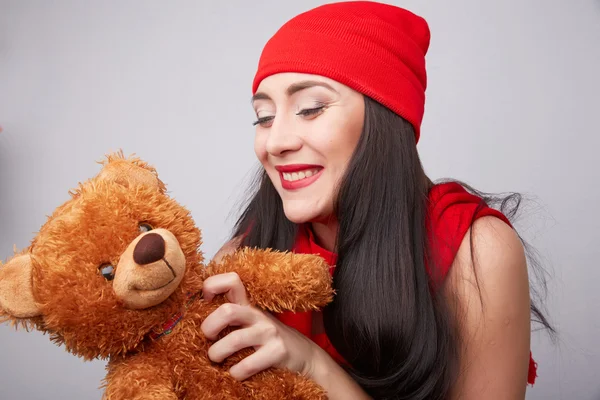 Brunette woman with teddy bear