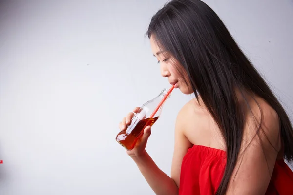 Chinese woman drinking carbonated drink