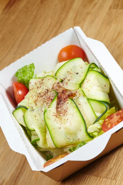 Vegetarian dish vegetables in cardboard box