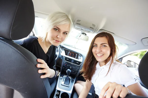 Happy girls in car