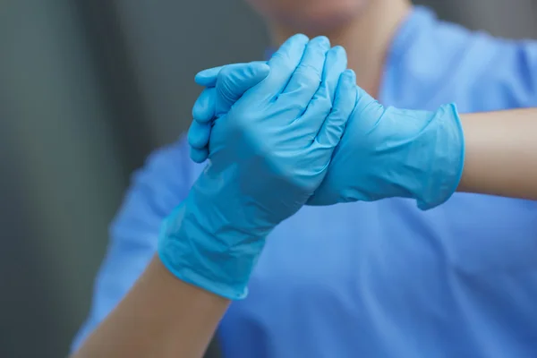 Doctor in medical gloves