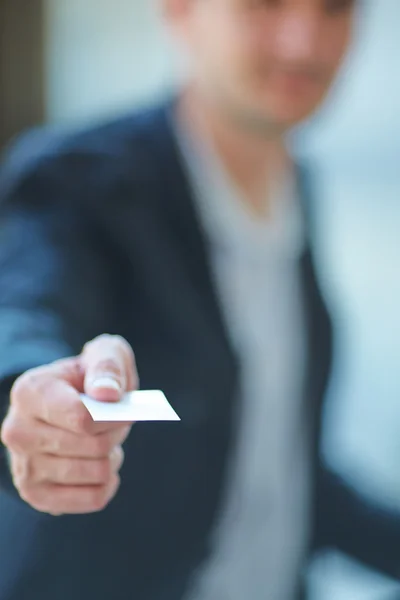 Male hand with business card